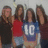 Four people pose together in a pixelated group photo with text overlays listing names and costume themes.