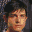 Four pixelated views of a person with dark hair against varied backgrounds including blue, white, and brown tones.