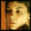 six pixelated showing a person's face in various expressions and angles against warm-toned backgrounds