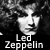 A 2x2 contact sheet of four black-and-white animated frames featuring close-up portraits of a person with long curly hair, each overlaid with the text "Led Zeppelin" in white pixelated font on a dark background.