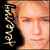 Static pixelated icon featuring a close-up of a person's face with light brown hair and visible facial features, alongside vertical text on the left side against a black background.