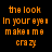 Pixelated text fragments in orange, pink, white, blue, green, and yellow on black background with no visible motion.