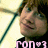 Pixelated image of a person with brown hair and a black shirt, holding a green object against a light background with pink text at the bottom.