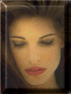 A static portrait of a person with closed eyes, red lips, and light brown hair, framed by a dark border with a subtle gradient.