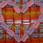 Animated heart-shaped frame with pink wavy border over a of orange and blue squares, transitioning from two hearts to one