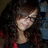 Pixelated static image of a person with long dark hair, light skin tone, and visible facial features including eyes, nose, and mouth.