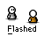 Pixelated cartoon figures with white faces and gray bodies, some wearing brown clothing, displayed in a beneath the word 'Flashed' on a gray background