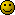 Pixelated yellow smiley face with black square eyes and a straight mouth, set against a light gray background.