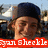 Pixelated image of a person with dark hair wearing a red banner displaying white text at the bottom.
