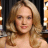 Static 48x48 pixel icon showing a close-up of a person with long wavy blonde hair against dark background, rendered in low-resolution pixel art style with visible dithering and color blending.