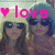 Pixelated image with two figures wearing sunglasses, a pink heart symbol, and the word 'love' in bright pink text above them.
