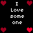 Pixelated black background with white text "I Love someone" and red heart icons in various positions.
