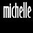 Pixelated black-and-white image showing two instances of the name "michelle" in stylized text with a skull and crossbones symbol below the right instance, displayed as a contact sheet of two frames on a transparent background.
