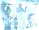 Animated sequence of band members performing on stage with instruments, captured in a