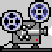 Pixelated gray robot with blue and black circular heads, red square feet, white accents on chest and arms, standing side-by-side in a