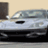 A silver sports car with a black grille and hood scoop is shown in three slightly different front-facing angles across a contact sheet layout.