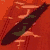 Red background with dark brown curved shape; white text 'FRANKS' on red ; blue shows stylized head silhouette; green and yellow show pixelated faces