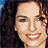 Pixelated close-up of a smiling person with dark hair against a blue background, rendered in low-resolution 48x48 pixels.