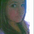 Pixelated static image of a person with light skin tone, dark hair, and a green garment, cropped on the right side.
