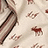 Pixelated static image showing scattered brown and white shapes on a light beige background with diagonal dark streaks.