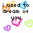 Pixelated text and heart shapes in multiple colors on a white background, with visible animation changes between frames.