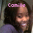 Pixelated image of a person with dark hair wearing purple clothing, overlaid with pink text reading 'Camille' at the top.