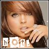 A close-up of a person with brown hair and blue eyes, wearing a ring on their right hand, with the word 'hotel' in pixelated letters at the bottom.