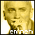 Pixelated image of a person with short hair, hands clasped under chin, and text 'eminem' at bottom; show slight mouth movement