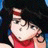 A 48x48 pixel buddy icon featuring a cartoon character with black hair and red clothing on the left, next to stylized text reading "Anime IM" and "com" on a black background.