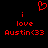 Red pixelated text and symbols on black background: 'i love Austin<33' with a heart symbol above the first 'i'.