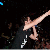 A pixelated image shows a person in mid-air with arms outstretched against a dark background, accompanied by text elements and orange splatter effects.