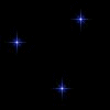 Multiple star-shaped light effects scattered across a black background, varying in color and brightness.