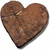 Four heart-shaped wooden icons with visible grain patterns and subtle shadows on a white background, arranged in a