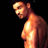 Pixelated static image of a shirtless male figure in profile against black background with warm orange and yellow tones.