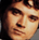 Six pixelated faces in a with one blue and white symbol on the right, all sharing similar warm-toned skin tones