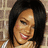 A pixelated image of a person with short dark hair smiling, set against a brick wall background, with the text 'don't stop the music' in black block letters.