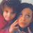 Two people pose closely together on a purple background with yellow text reading "meagan (33" and "melana (33 tosti (33".