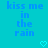 Pixelated blue text on cyan background reads 'kiss me in the rain' with two heart symbols below.
