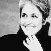 nine shows a person with short light hair in a dark turtleneck, hand near chin, against a sepia-toned background with subtle variations in lighting and color tone