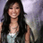 A pixelated image of a person with long dark hair wearing a light-colored top, next to bold text reading "BRENDA ROCKS !!!!!" on a beige background.
