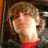 Pixelated image of a person with light brown hair and red clothing, next to red text reading 'Nuff Said :]'.