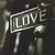 six showing a black-and-white background with red and blue text overlays, displaying phrases about love and one-way streets