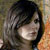 Pixelated portrait of a person with dark hair and light skin, set against a blurred background with warm and cool tones.