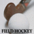Static field hockey icon showing a brown stick with red tip on white background and "FIELD HOCKEY" text below.