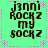 Green background with pink dotted lines and star shapes, displaying four identical text blocks reading 'j3nni Rockz my sockz' in brown pixelated font.