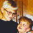 Pixelated image of two people with text elements and heart shapes on a white background.