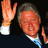 A 4-frame contact sheet of an animated icon showing Bill Clinton in a dark suit with white shirt and blue striped tie, waving his right hand across frames.