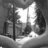 Black-and-white pixelated scene of a street with trees and a lamppost, next to blue pixelated text reading "my heart dropped when he said like a sis" on black background.