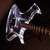 Pixelated image of a silver electric guitar with brown neck and body against dark background, next to white text 'luyer' on black background.