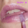 A close-up of lips with glossy pink lipstick and a purple lip applicator, overlaid with repeated text "just a girl" in light purple script.